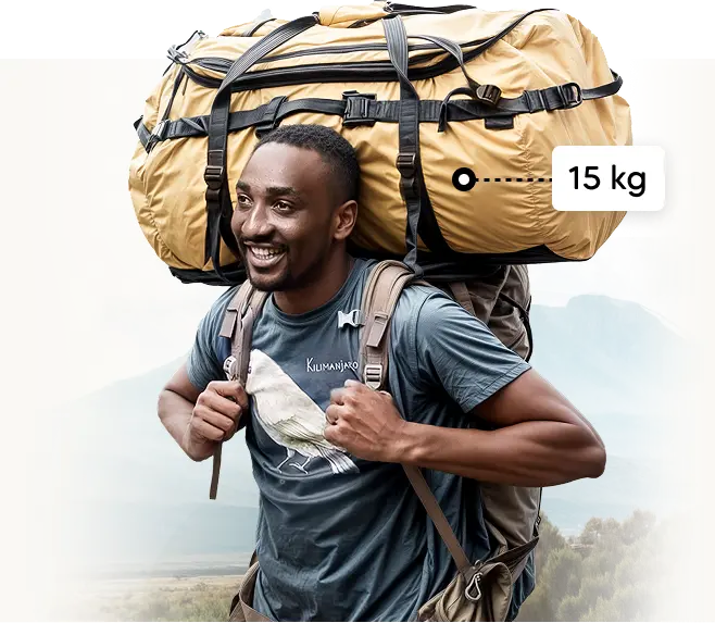 Kilimanjaro-medlem af det lokale logistikteam bærer en 15 kg ekspeditionsduffelbag Kilimanjaro-medlem af det lokale logistikteam bærer en 15 kg ekspeditionsduffelbag
